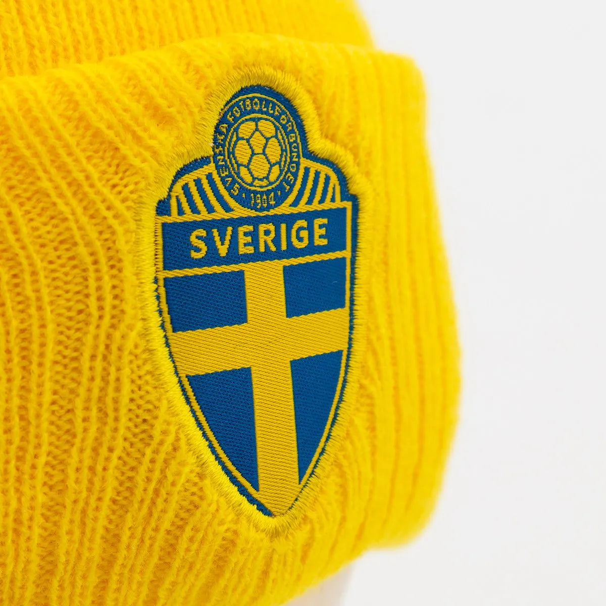 Stickad mössa gul/marinblå